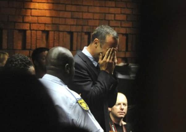 Athlete Oscar Pistorius weeps in court in Pretoria at his bail hearing in the murder case of his girlfriend Reeva Steenkamp.