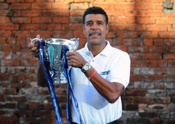 Chris Kamara with the Captial One trophy.
