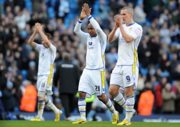 Leeds United players applaud the support from the fans.