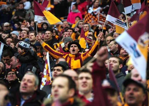 Bradford City fans show their vocal support in the stands during the Capital One Cup Final match at Wembley