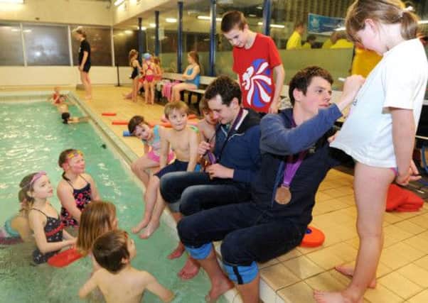 Alistair and Jonathan  Brownlee signing autographs for young swimmers at their old club Aireborough Swimming Club, Aireborough Leisure Centre, Guiseley