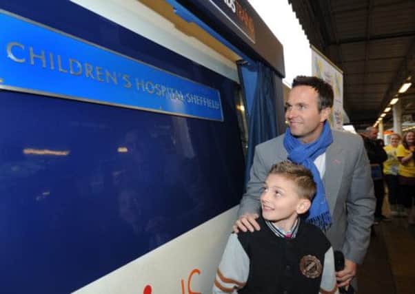 Michael Vaughan and 10-year-old Owen Wilkinson of Barnsley, whose life was saved at the hospital