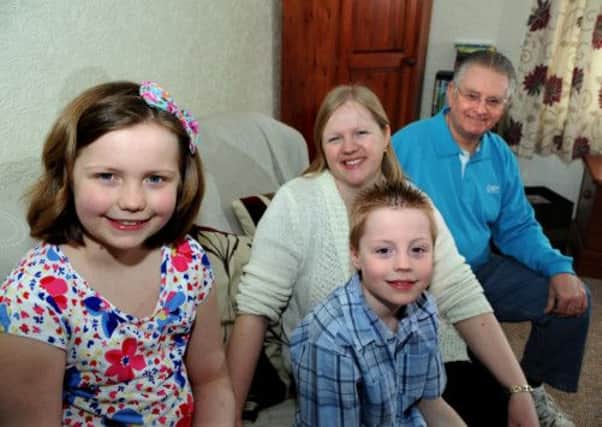 Ellie and mum Lindsey Thompson, brother Josh and granddad Keith Twelvetrees in the PACT house in Sheffield