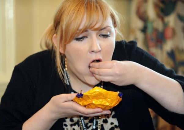 Jessica Owens, a National Trust assistant, takes part in the world record attempt to eat  a Terry's chocolate orange