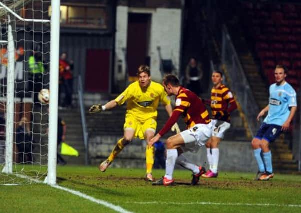 James Hanson prods the ball to score a late equaliser