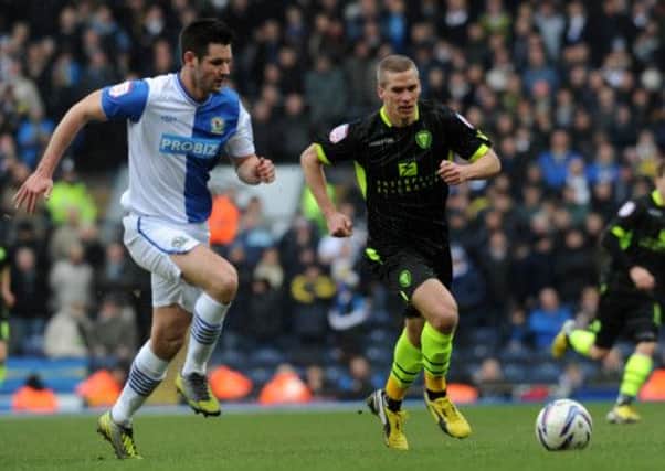 Scott Dann and Steve Morison chase a loose ball in the Blackburn-Leeds match