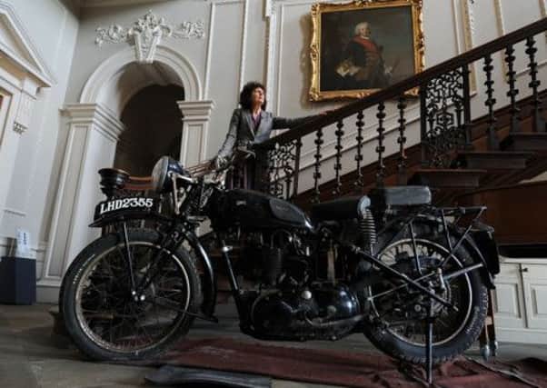 Wendy Taylor, project officer at Beningbrough Hall, with a military Triumph motorbike . Picture by Gerard Binks. Below: Bob Schofield his infamous motorbike