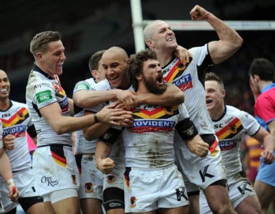 Jarrod Sammut is congratulated by his team mates after scoring a try