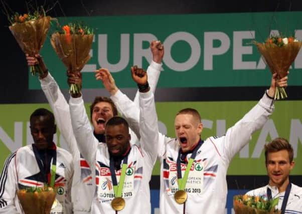 Great Britain's Michael Bingham, Richard Buck, Nigel Levine and Richard Strachan celebrate winning the gold medal in the men's 4x400metres relay