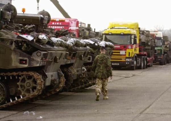 A line of Combat Engineer Tractors is made ready at Claro Barracks to be transported towards the Gulf.
