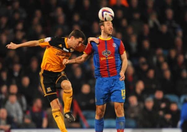 Hull City's Alex Bruce (left) and Crystal Palace's Glenn Murray battle for the ball. (Picture: Dominic Lipinski/PA Wire).