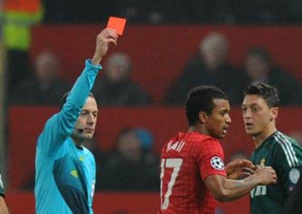 Manchester United's Nani receives a red card from referee Cuneyt Cakir during the UEFA Champions League match with Real Madrid. (Picture: Martin Rickett/PA Wire).