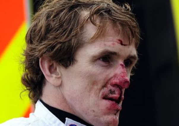 Tony McCoy arrives back at the medical room after his fall from Mr Watson