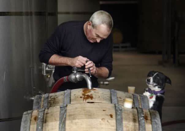 Kevin Judd of Greywacke fills barrels with wine