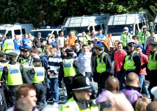Millwall fans outside Elland Road as police keep an eye on events.