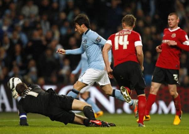 Manchester City's David Silva scores his side's fifth goal