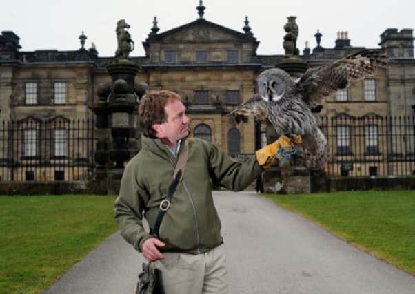 Charlie Heap holds a Great Grey Owl