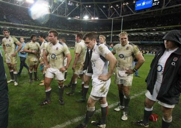 England's players stand dejected after the game during the RBS 6 Nations match at the Aviva Stadium, Dublin, Ireland two years ago.