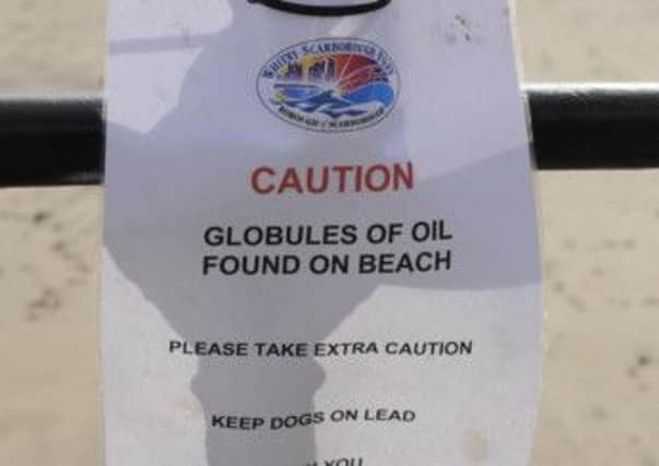 Oil warning signs have been placed on the South Bay in Scarborough