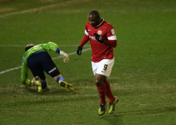 Barnsley's Jason Scotland celebrates scoring during the npower Championship match at Oakwell. (Picture: Lynne Cameron/PA Wire).