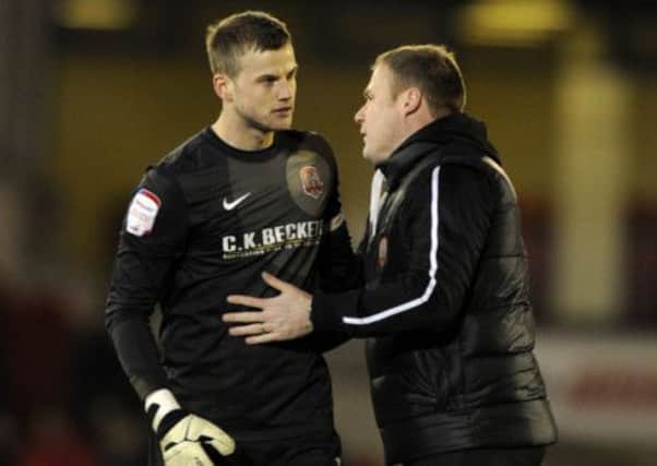 Luke Steels gets a well done from his manager David Flitcroft