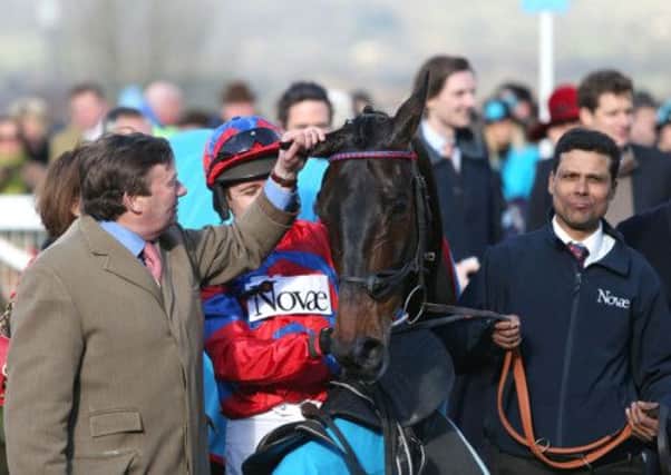 Winning trainer Nicky Henderson (left) with Sprinter Sacre and jockey Barry Geraghty (centre) after victory in the Sportingbet Queen Mother Champion Chase during Ladies Day at the 2013 Cheltenham Festival