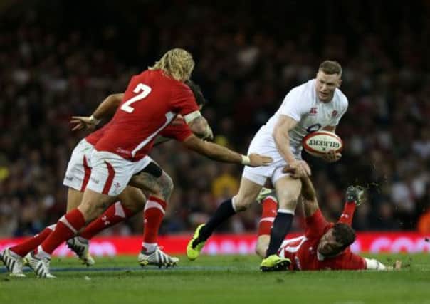 IN THE WAY: England's Chris Ashton finds himself surrounded at the Millennium Stadium.