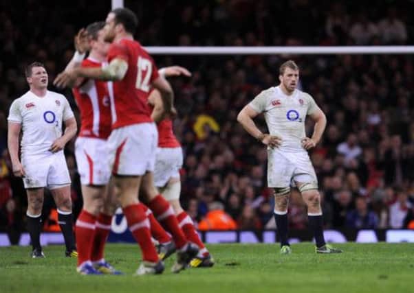 England's Chris Robshaw (right) stands dejected