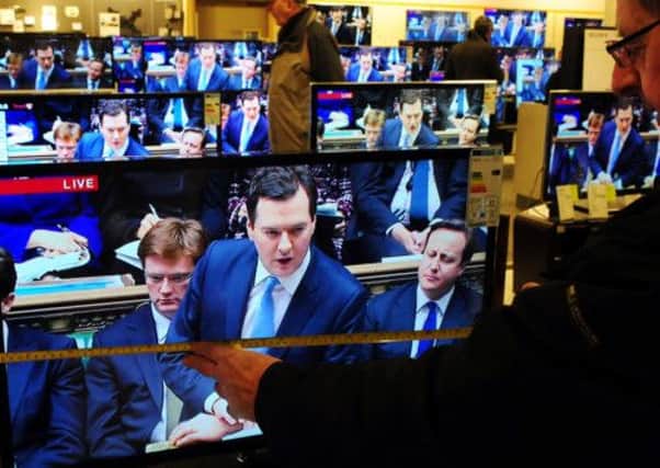 As seen on TV: Chancellor George Osborne during the Budget announcement. Cartoon by Graeme Bandeira.