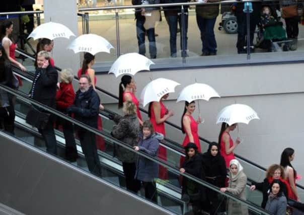 Models from Coast on the escalators for the opening of the Trinity Shopping Centre. Picture by Simon Hulme