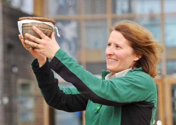 Katie Thorn from The Forestry Commission with a bronze age food vessel. Picture: Tony Bartholomew