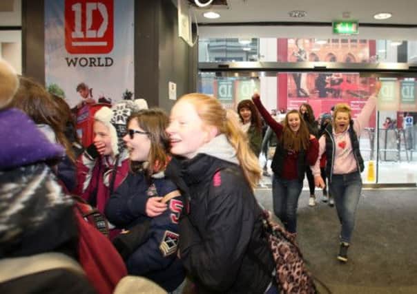 Crowds at the opening of the UK's first '1D World' pop up store at the Trinity shopping centre, Leeds.