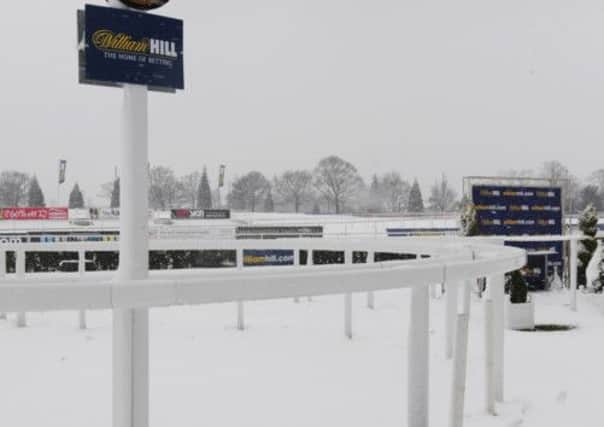 A snowy scene in the winner's enclosure as day two of the William Hill Lincoln Meeting at Doncaster Racecourse