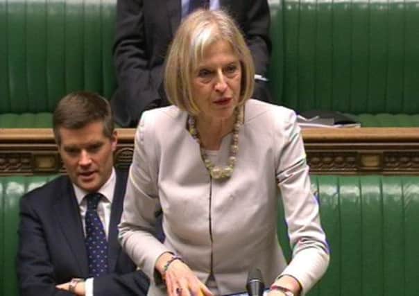 Home Secretary Theresa May speaks to the House of Commons. Below: Lin Homer, who was promoted to the £180,000-a-year role of chief executive of HM Revenue & Customs after her performance at the UK Border Agency