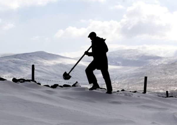 Farmer Gareth Wyn Jones during the search for sheep trapped beneath snow on his farm in Llanfairfechan, North Wales.