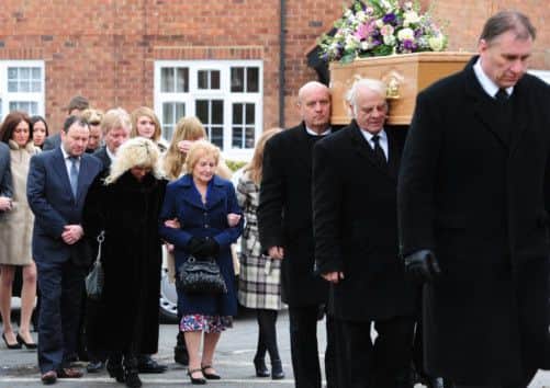 Lucy Collier (centre) widow of comedian Norman Collier arrives for his funeral service at St Helen's Church, Welton, Hull.  Below: Comedians Roy Walker (left) and Roy Hudd