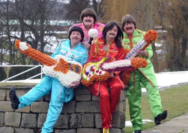 Swapping plectrums for petals, Simon Blight, Colin Yates, James Jordan and Roger Channing aka The Upbeat Beatles tribute band