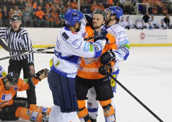 FRUSTRATION: Ashley Tait gets to grips with Coventry's Derek Campbell on a disappointing evening for Sheffield Steelers. Picture: Dean Woolley.