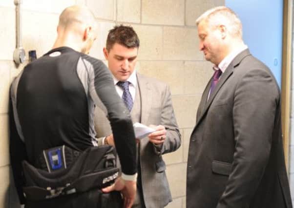 LAST TIME: Ryan Finnerty discusses tactics with assistants Ashley Tait and Neil Abel during a period break in the Challenge Cup final against Nottingham Panthers on Tuesday night. Less than 24 hours later, he was fired by Sheffield Steelers owner Tony Smith. Picture: Dean Woolley.