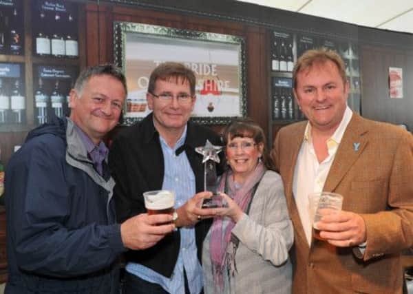 Last year's favourite pub is crowned at the Great Yorkshire Show. ITV weatherman Jon Mitchell is pictured with Kevin Laing and Christine Cullen from the White Horse Farm at Rosedale Abbey, and Gary Verity of Welcome to Yorkshire.
