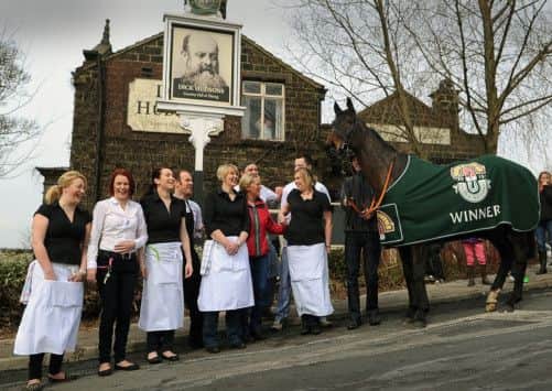 Grand National winner Auroras Encore meets the staff at Dick Hudson's pub. Picture by Gerard Binks