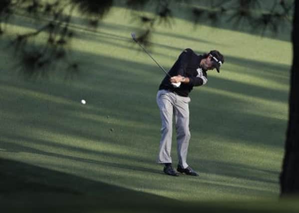 Bubba Watson hits off the fifth fairway during a practice round for the Masters golf tournament Monday, April 8, 2013, in Augusta. (AP Photo/Darron Cummings).