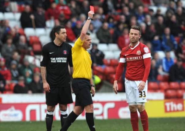 Barnsley's Tom Kennedy reacts as he is sent off by referee Geoff Eltringham