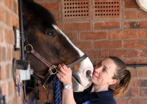 Police horse handler Isabelle Collins, with Bud, of West Yorkshire Police's mounted section