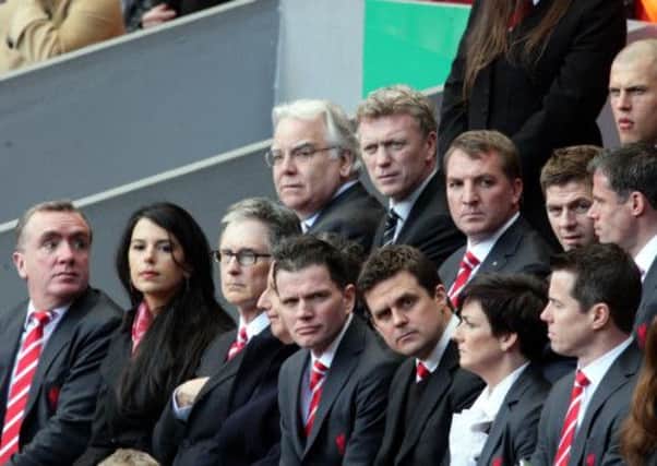 Liverpool Football Club owner, John Henry (front row third left) Bill Kenwright, the Chairman of Everton Football Club (middle row left) and Everton FC's manager David Moyes (middle row second left).