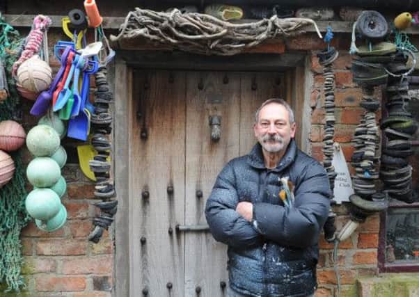 John outside his studio called 'the shed'