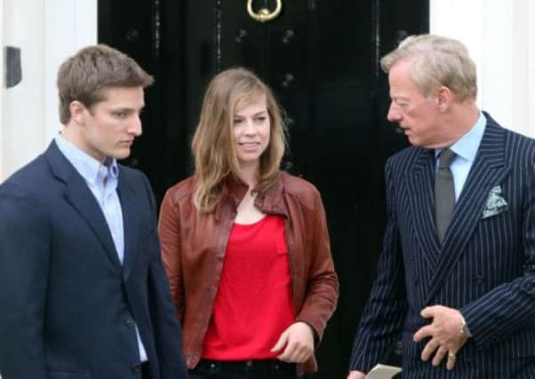 Mark Thatcher (right) with his son Michael and daughter Amanda outside the home of his late mother former Prime Minister Margaret Thatcher