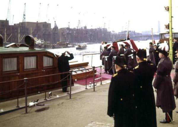 The coffin of Sir Winston Churchill making it's way up the River Thames to Festival Pier on board the Havengore.