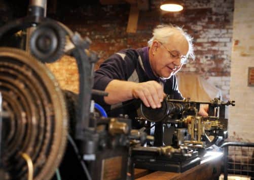Steve Lumb with a medallian lathe in the Calderdale Industrial Museum