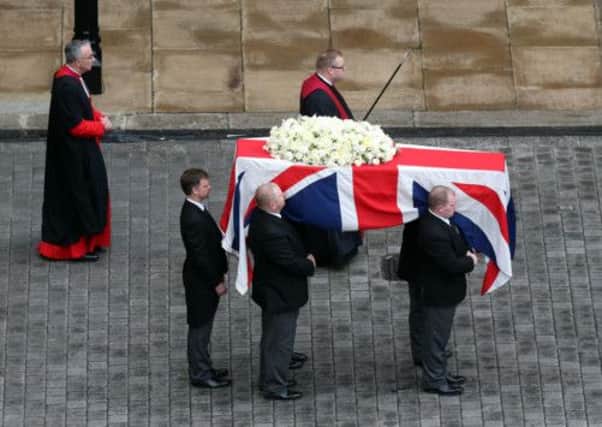 The coffin bearing the body of Baroness Thatcher is moved from the Palace of Westminster